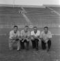 Photograph: [Ferrill kneeling with football coaches #1]