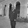 Photograph: [Dr. Kenneth Cuthbert in front of Bruce Hall, 3]