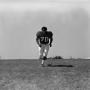 Primary view of [Football player #70, Jimmy Franklin, jogging toward the camera]