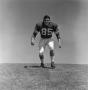 Photograph: [Football player #85, Steve Atchley, stands imposingly]