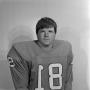 Photograph: [Football player sitting for a portrait, 22]