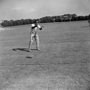 Primary view of [Man standing in a football field]