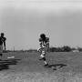Photograph: [Football player #34 attempting to catch a low ball]