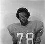 Photograph: [Football player sitting for a portrait, 36]