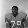 Photograph: [Football player sitting for a portrait, 33]