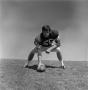 Photograph: [Football player #56, George Bray, crouched in 3 point position, 2]