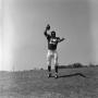 Photograph: [Football player #15, George Woodrow, caught mid throw]