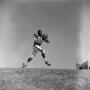 Photograph: [Football player #88, Carl Hayes, reaches out for a ball]