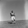 Photograph: [Football player #28, David Jones, jogging down field]