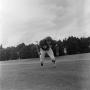Photograph: [Football player running on the field, 67]