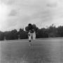 Photograph: [Football player running on the field, 73]