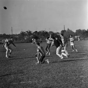 Primary view of object titled '[Student throwing a football, 2]'.