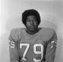 Photograph: [Football player sitting for a portrait, 24]