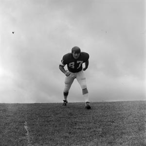 Primary view of [Football player running on the field, 83]
