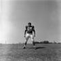 Photograph: [Football player #69, Mike Strum, standing upright with his legs apar…