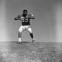 Photograph: [Football player #89 moves back with arms in a T-shape, 2]