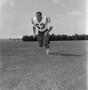 Thumbnail image of item number 1 in: '[Football player number 63 running through a football field, 3]'.