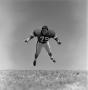 Photograph: [Football player #79, Louis Roche, mid tackle, 2]