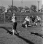Photograph: [Football players tackling an opponent, 8]