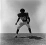 Photograph: [Football player #26, Perry Pratt, standing in 2 point position]