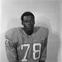 Photograph: [Football player sitting for a portrait, 26]