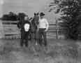 Photograph: [Ted Gouldy with a man and a horse, 2]