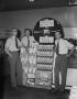 Photograph: [Three men posing with a Wesson Oil and Snowdrift display]
