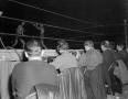 Photograph: [Reporters at a boxing match]