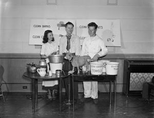 Primary view of object titled '[4-H Club milk demonstration with reporter Layne Beaty]'.