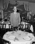 Photograph: [Don McNeill Standing Behind a Table]