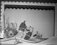 Photograph: [Puppet and jar scene in Dean Raymond Puppet Show]