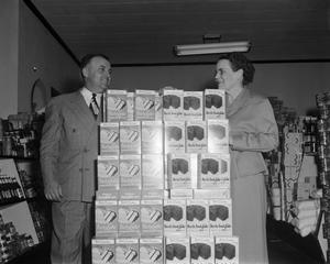 Primary view of object titled '[Man and woman with a Betty Crocker product display]'.