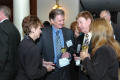 Photograph: [Conference guests conversing over drinks]