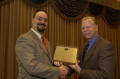 Photograph: [Donnis Bagget handing out plaque award]