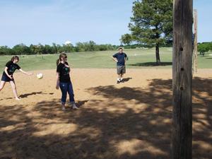 Primary view of object titled '[Three TNT members on volleyball court]'.