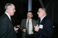 Photograph: [Charles Moser and Doug Toney at cocktail reception]