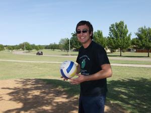 Primary view of object titled '[TNT member with volleyball]'.
