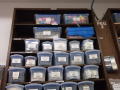 Photograph: [Boxes full of small items on shelves]