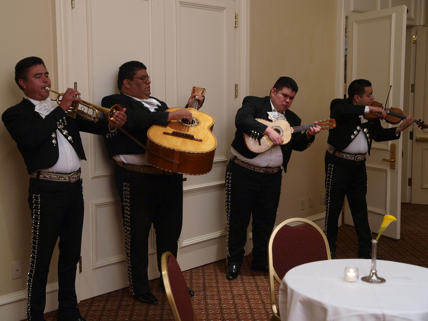 [Mariachi band performing at the TDNA dinner], Photograph of a local mariachi band performing for the guests at the 2008 Texas Daily Newspaper Association annual conference awards dinner, held at The Westin Riverwalk Hotel in San Antonio, Texas., 