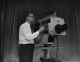 Photograph: [Tom Bedford fixing television camera]