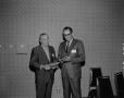 Photograph: [Roy Bacus with awards]