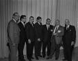 Photograph: [Men posing for a picture at NAB Convention]