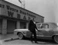 Photograph: [Hap Arnold in front of the WBAP building]
