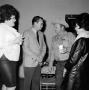 Photograph: [Bill Mack socializing with Corky Kuykendall and other people at Pant…