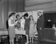 Photograph: [Women, man, and child at WBAP Radio 46th Anniversary]