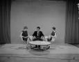 Photograph: [Bobbie and guests seated on set]