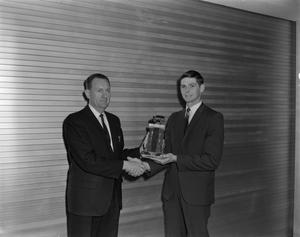 Primary view of object titled '[Man receiving an award]'.