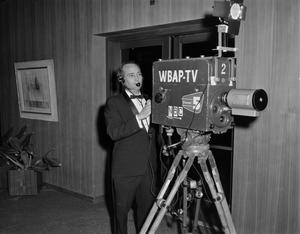 Primary view of object titled '[Cameraman at the Scott Theatre Opening]'.