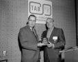 Photograph: [Roy Bacus presenting a award to a Man]