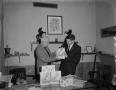Photograph: [Men holding Charmin products]